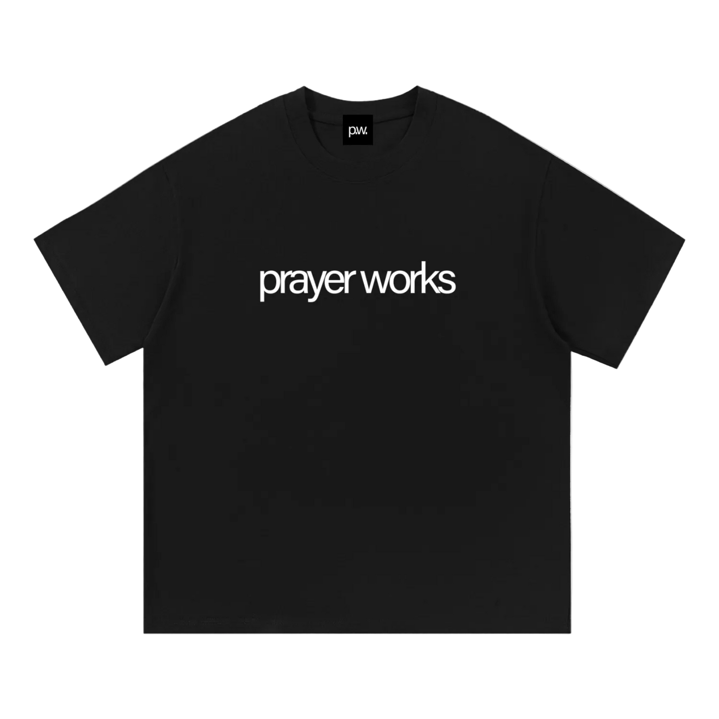 Black t-shirt with 'prayer works' text on a white background